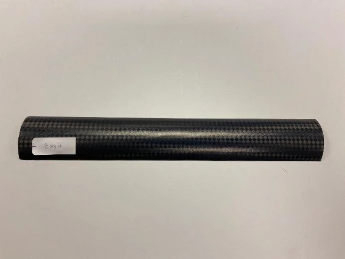Deployed carbon-fiber boom on a work surface