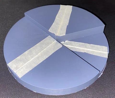 Purple 3D-printed rigid-panel folding mechanism with tape hinges